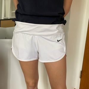 White Nike Dri-Fit shorts with built-in spandex